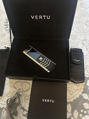 Vertu < 2 ГБ, цвет - Серебристый, Кнопочный