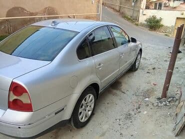 avtobus oturacaq: Volkswagen Passat: 1.8 l | 2003 il Sedan — 4