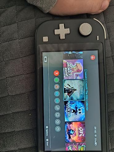 notbuklarin satisi: Nintendo switch lite satılır bir qüsürü yoxdu adaptırı yanında hediye — 8