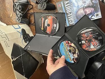 PlayStation 2 Slim komplekti Məzmun: - 2 ədəd Sony PlayStation 2 Slim — 4