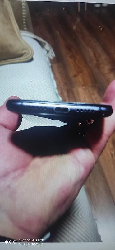 islemis telefonlarin satisi: Xiaomi Mi 9 Lite, rəng - Qara, 
 Barmaq izi — 3