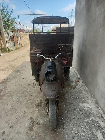 oturacaq avtomobil: Məhsul: Yükdaşıma üçün üçtəkərli motorlu arabadır (motoblok/triportyor — 2