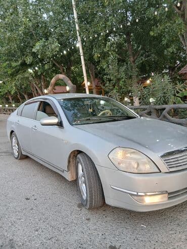 запчасти на фольксваген гольф 2: Gümüşü rəngli Nissan Teana avtomobili. Avtomobilin qabaq hissəsindəki — 2