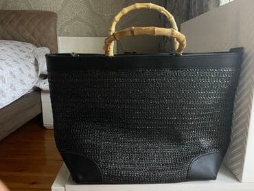 qaşlı çanta: Stradivarius böyük həsir çanta.Kənarları kojadır,qulpu bambukdur.1 — 1