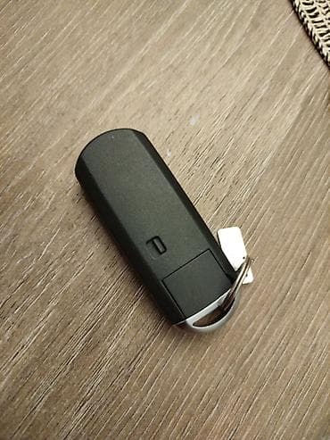 santafe 2012: Mazda smart açar (keyless) – 4 düyməli Xüsusiyyətlər: - Uzaqdan — 3