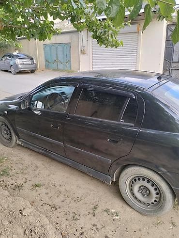 Model: Opel Astra G (sedan, 4 qapı) Rəng: qara Transmissiya: mexaniki