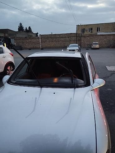 kia az: Gümüşü rəngdə sedan, idman üslublu eksteryer paketi ilə. - Kuzov: 4 — 9