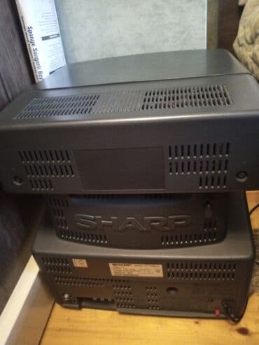 smart tv klaviatura: Satili sharp firmasi, rengli kicuk ekran kohne videokasetle birlikde — 1