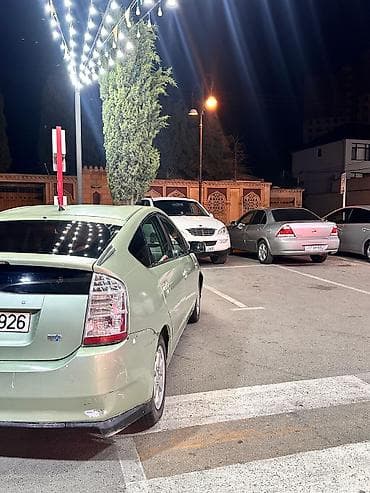 baqaj: Toyota Prius (2-ci nəsil) hibrid hetçbek - Gümüş-yaşıl rəngli kuzov — 4