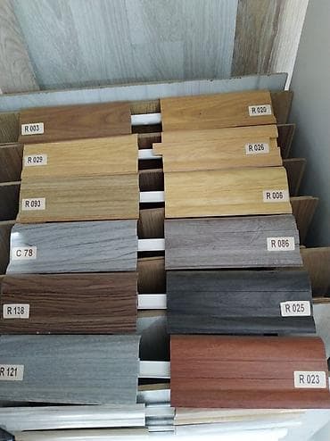 Müxtəlif rəng və dizaynlarda laminat döşəmə nümunələri. Hər bir nümunə