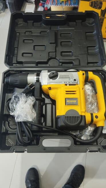 Zərbəli matkap, dəmir-beton, kərpic və digər tikinti materialları ilə