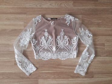 yupqa kofta: Naxışlı ağ krujeva detalları olan bej rəngli qısa kofta. 34 razmerə — 5