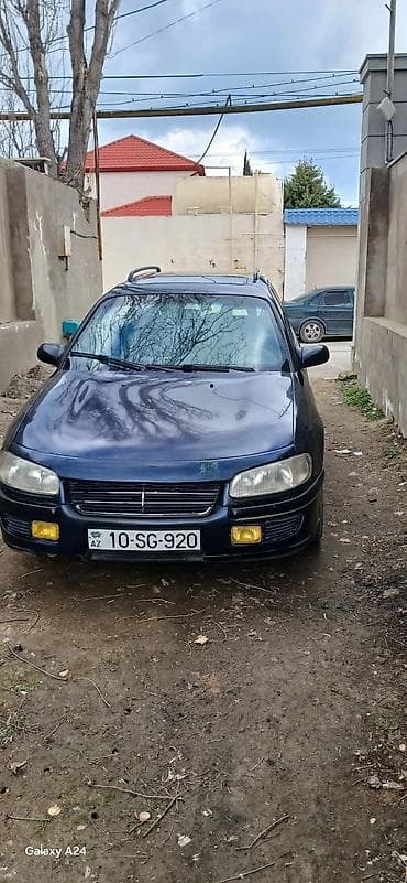 Opel: Opel Astra F Caravan (universal), tünd mavi rəng. - Kuzov: universal — 4