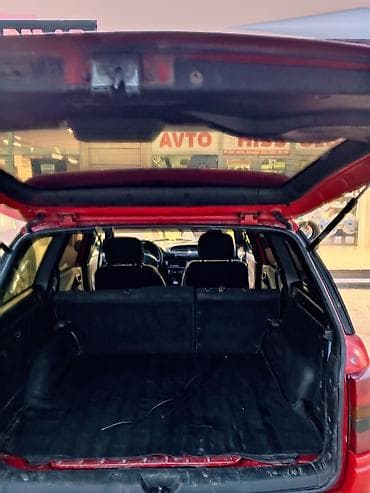 vaz 2107 maşını: Opel Astra F Caravan (universall) – qırmızı rəng. şəxsi sahibiyəm Heç — 4