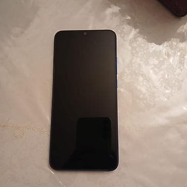 Xiaomi Redmi smartfon - Model: Redmi A seriyası (şəkildə mavi arxa