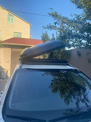 eşşək arabası: Avtomobil üçün dam üstü baqaj qutusu (roof box). Aerodinamik formalı — 2