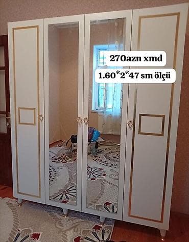 ortuk: Ağ rəngli 4 qapılı paltar şkafı. Ön hissədə iki böyük güzgülü qapı — 1