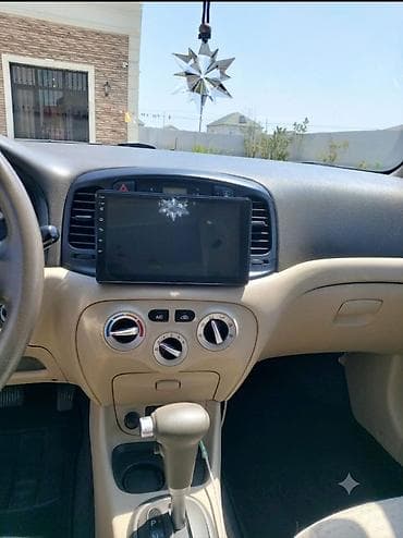 multi sukan: Hyundai Accent: 1.4 l | 2008 il Sedan — 4