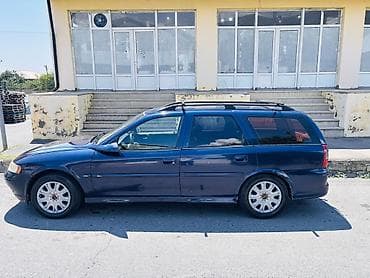 46 kuza: Opel Vectra Caravan (Universal), tünd mavi rəng. Xüsusiyyətlər: - — 6