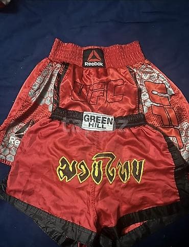 kisi geyimləri: - İdman şortu dəsti - Modellər: - Reebok UFC temalı qırmızı şort — 1