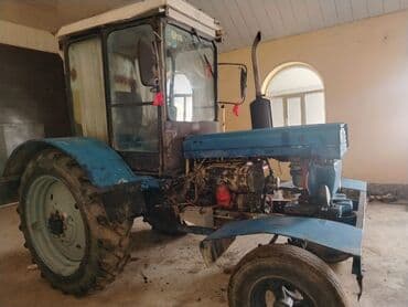 reduktor sürətlər qutusu: Mavi rəngli kabinalı təkərli traktor - Güclü dizel mühərrik (şəkildə — 7