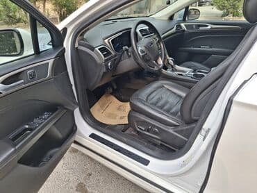 qubada ucuz avtomabiller: Ağ rəngdə Ford Fusion sedanı. Bu avtomobilin salonda rahat — 9