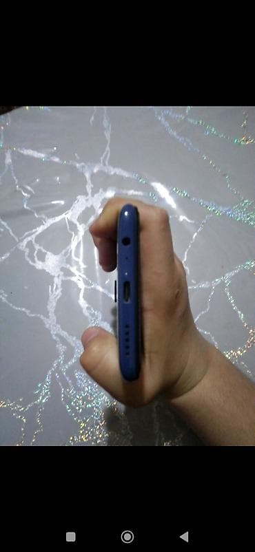 planşetlər və qiymətləri: Xiaomi Redmi (model arxa qapaqda “Redmi” loqosu ilə). Rəng: tünd mavi — 5