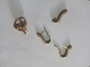 1 qram qizilin qiymeti: Dəstə daxildir: Üzük, Sırğa, Kulon, Gümüş — 4