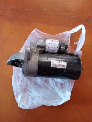 vurulmuş maşınlar: Avtomobil starter motoru, model 18949N. 12 volt gərginliklə işləyir və — 1