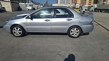 ford focus hatchback: Mitsubishi Lancer: 1.6 l | 2006 il 466000 km Sedan — 1