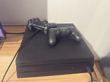 plastation 1: Ps4 Pro - 1TB yaddaş + 2 DualShock Wireless Controller Terkibinde 12 — 1