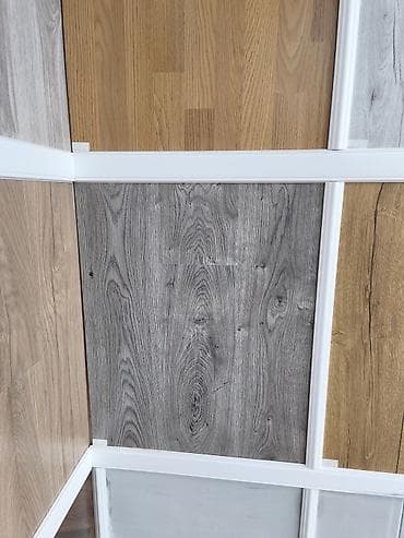 Laminat döşəmə panelləri – müxtəlif ağac fakturaları və rəng seçimləri