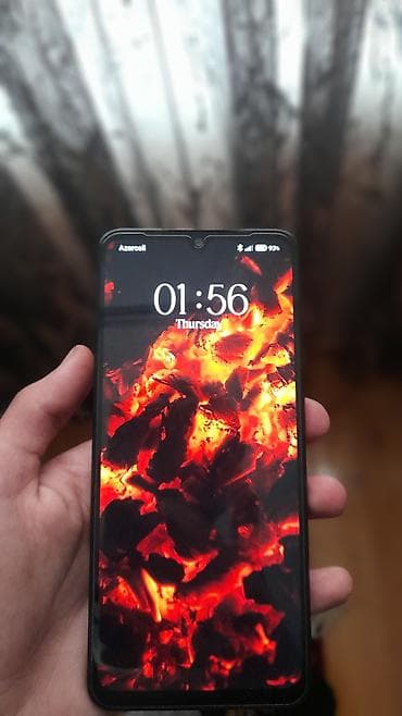 telefon ən ucuz: Smartfon – damcı şəklində ön kamera çıxıntısı olan tam ekranlı model — 1