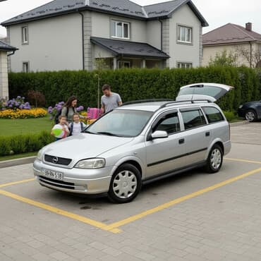 Opel Astra Caravan (universal), gümüşü rəng. - Kuzov: 5 qapılı