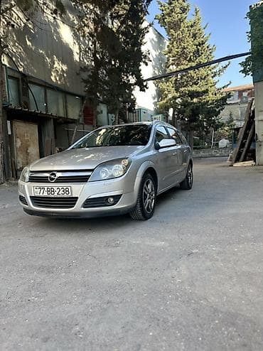 opel astra k: Opel Astra H Caravan (universal), gümüşü rəng. - Kuzov: 5 qapılı — 6