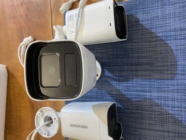 mini gizli kamera kablosuz: Ağ rəngdə Hikvision şəbəkə kamerası. Bu kamera dəsti ev, ofis və ya — 3