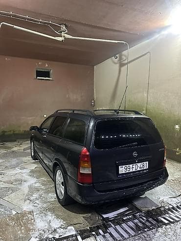 prius qapi: Opel Astra Caravan (Universal) – qara rəng Xüsusiyyətlər: - Kuzov — 4