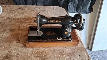 Antik mexaniki tikiş maşını - Korpus: döymə metal, qara lak örtük