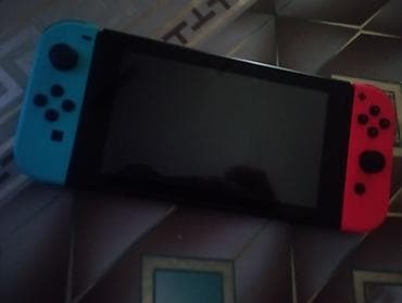 Nintendo Switch (Neon Blue/Neon Red Joy‑Con) - Daşınan və TV‑yə