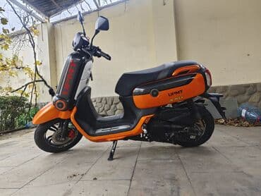 led panel: UPMT X-MAX skuter – parlaq narıncı-qara dizayn, şəhər üçün çevik və — 1