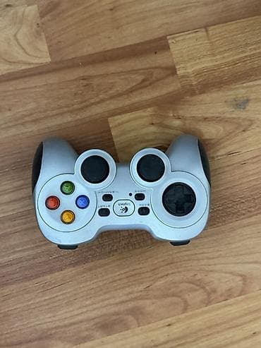 Logitech gamepad (simli/wireless modellərinə bənzər F‑seriyası — 1