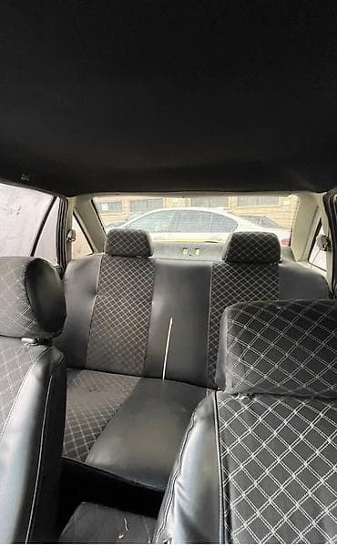 ferrari satilir: Model: Daewoo Nexia (sedan) Rəng: sarı Kuzov: 4 qapılı, ön və arxa — 5