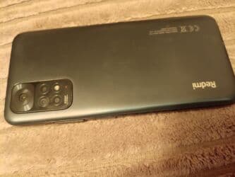 İnformatika: Xiaomi Redmi smartfon - Arxa paneldə “Redmi” loqosu və çoxmodullu — 1