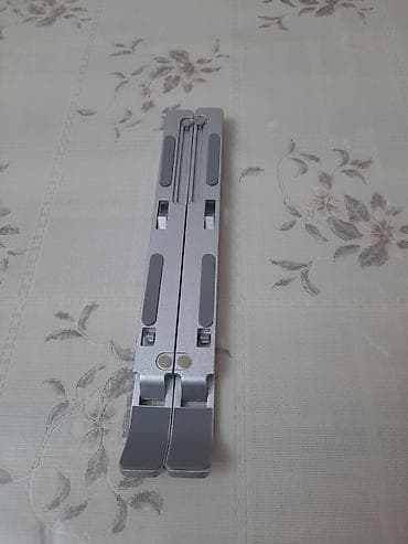 for x: Məhsul: Laptop Stand – Creative Folding Storage Bracket salam əziz — 6