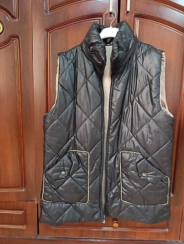 casio qol saati: Qadın üçün yastı tikişli, qara rəngli quilted jilet. - Material — 2