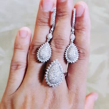 1 qram qızılın qiyməti 2024 750: Dəstə daxildir: Üzük, Sırğa, Bilərzik, Ağ qızıl, 750 Əyar, 1511 g — 2