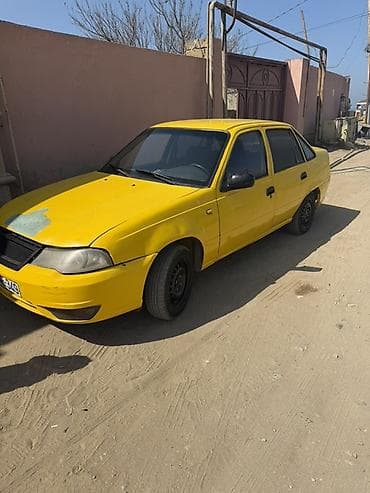 ferrari satilir: Model: Daewoo Nexia (sedan) Rəng: sarı Kuzov: 4 qapılı, ön və arxa — 2