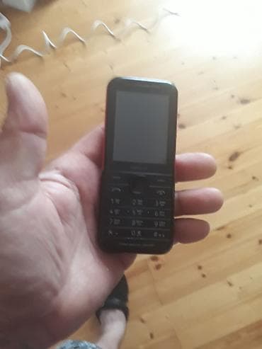 prastoy telfon: Model: nokia (düyməli telefon) Xüsusiyyətlər: - Korpus: kompak, qara — 9