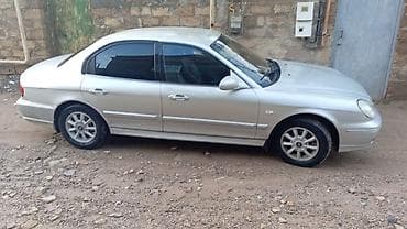 suktur: Hyundai Elantra (J3) sedan, gümüşü rəng. - Kuzov: 4 qapılı sedan — 9