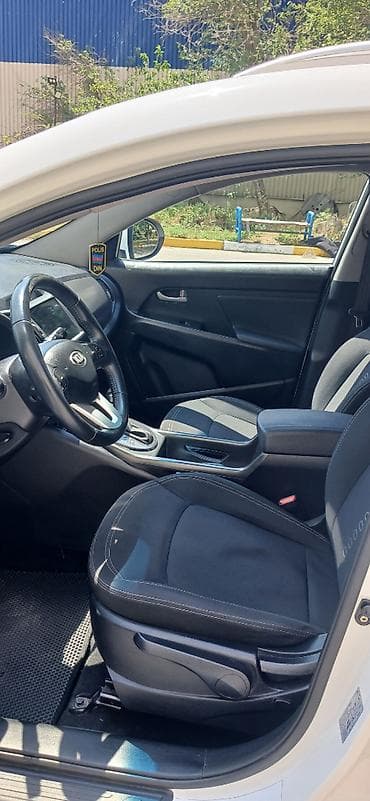 Kia Sportage: 2 л | 2013 г. Внедорожник — 7